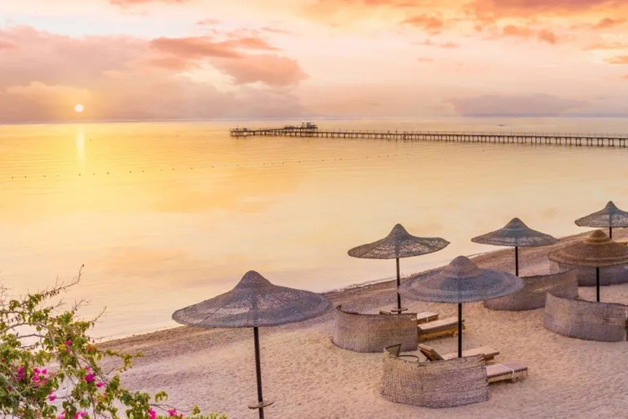 A quiet Hurghada beach and jetty on the Red Sea at sunset