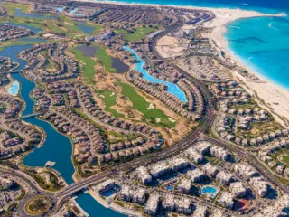 An aerial view of lagoons and turquoise sea on the Mediterranean coast at El Alamein