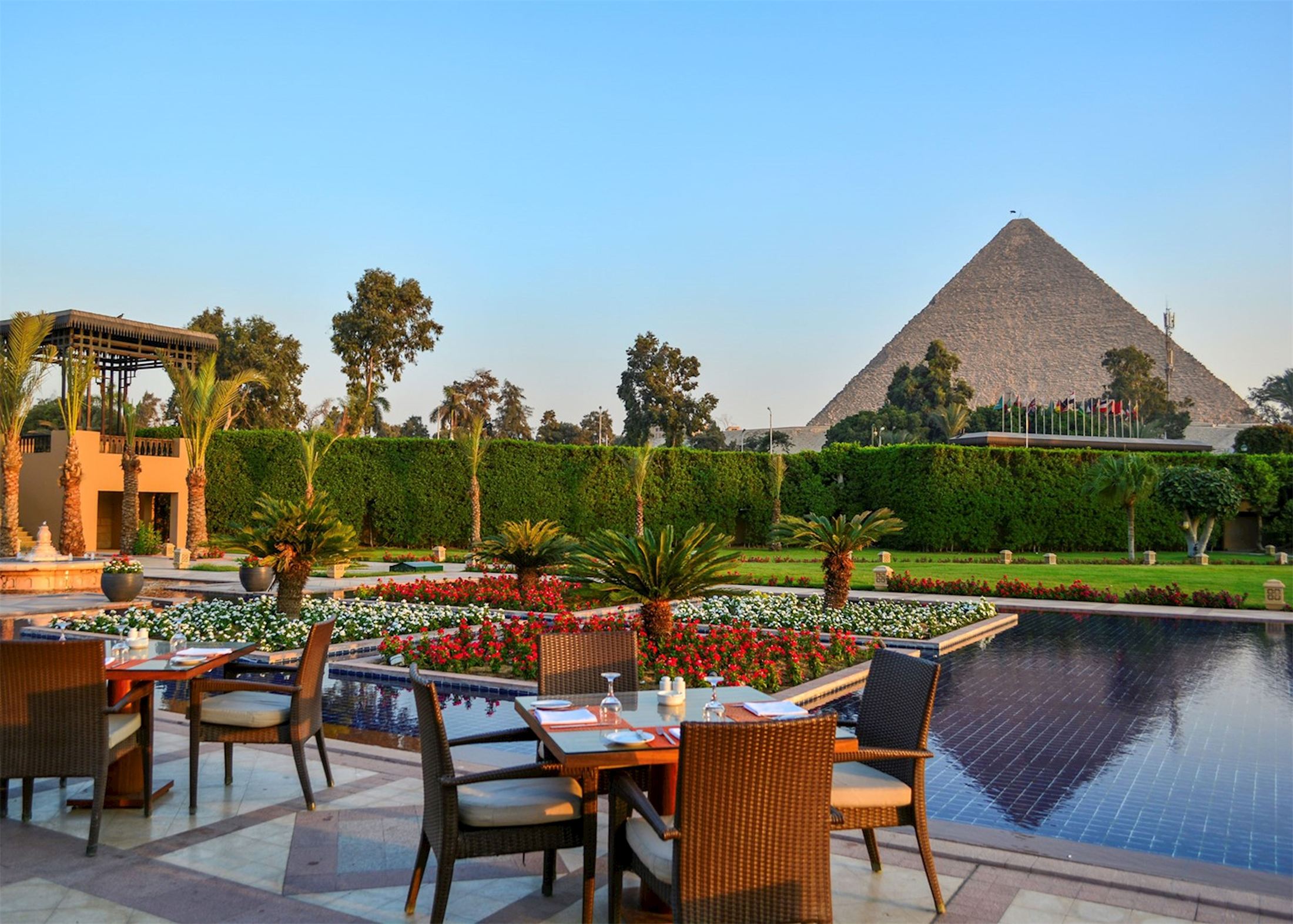 The Great Pyramid rising above the gardens of Mena House at Giza